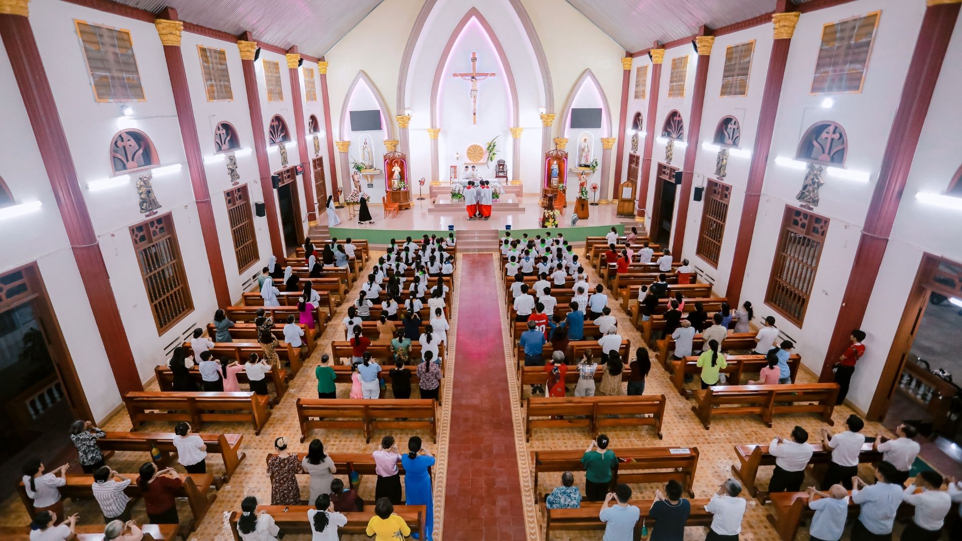Overhead view of an entire congregation gathered in church pews for worship